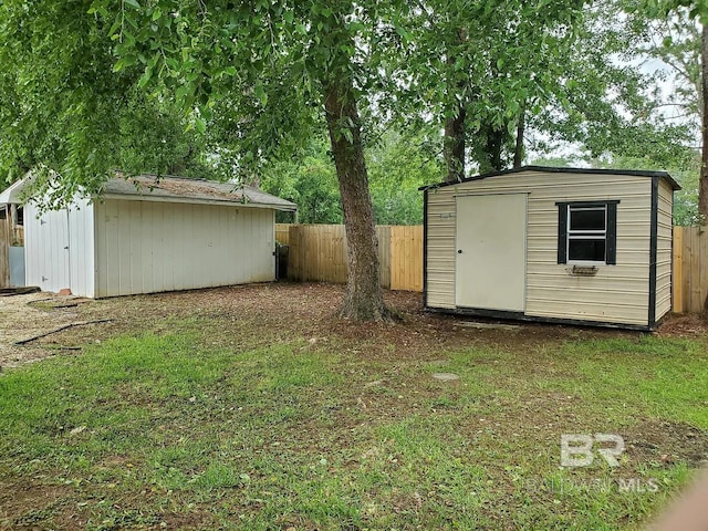 view of shed featuring a fenced backyard