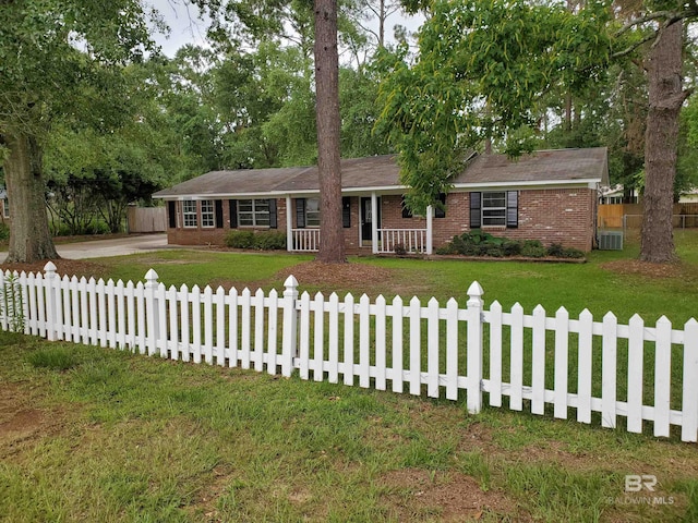 ranch-style home with brick siding, central AC, covered porch, and concrete driveway
