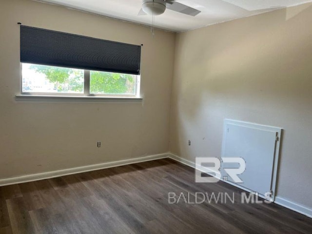 26225 Marina Rd, Orange Beach, AL 36561 - empty room with a ceiling fan, wood finished floors, and baseboards