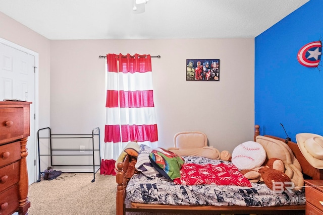 carpeted bedroom with a textured ceiling