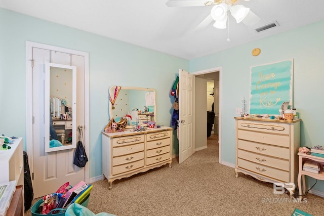 bedroom featuring ceiling fan and light carpet