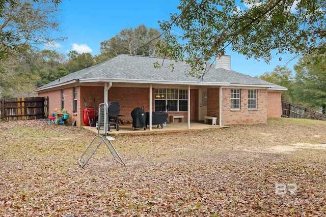 rear view of house featuring a patio