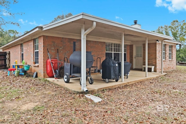 rear view of house featuring a patio