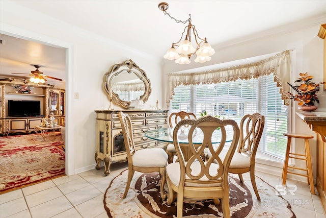 tiled dining space with crown molding and ceiling fan with notable chandelier