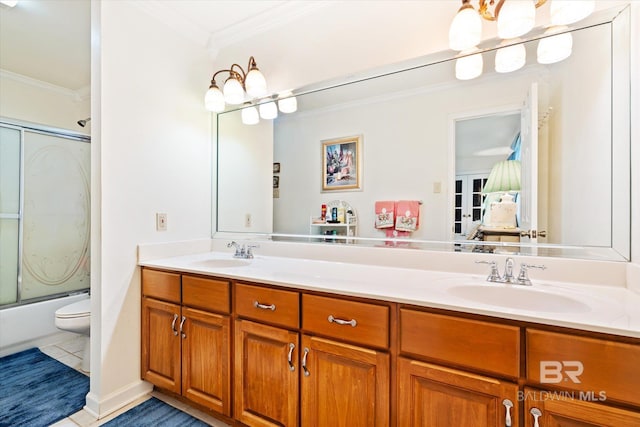 full bathroom featuring tile patterned floors, crown molding, vanity, and combined bath / shower with glass door