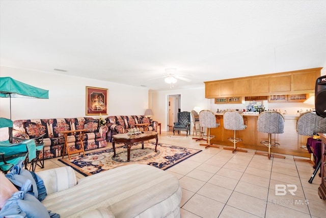 tiled living room featuring ceiling fan