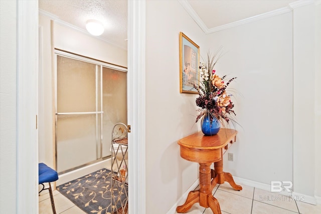 bathroom with tile patterned flooring, a textured ceiling, walk in shower, and crown molding