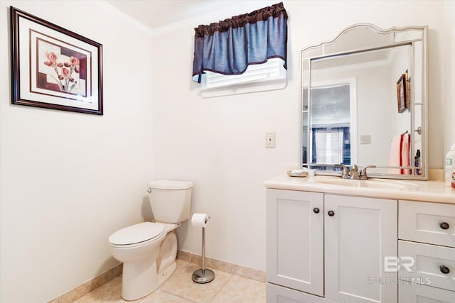 bathroom featuring tile patterned floors, toilet, vanity, and ornamental molding