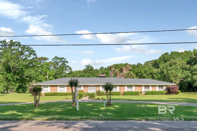 1180 Dawes Rd, Mobile, AL 36695 - single story home with brick siding, a chimney, and a front lawn