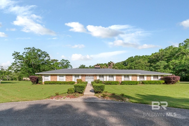 1180 Dawes Rd, Mobile, AL 36695 - single story home featuring a chimney and a front yard