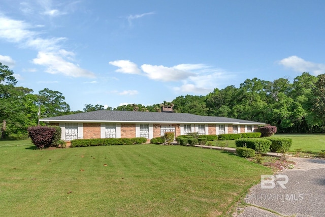 1180 Dawes Rd, Mobile, AL 36695 - single story home featuring brick siding, a chimney, and a front yard