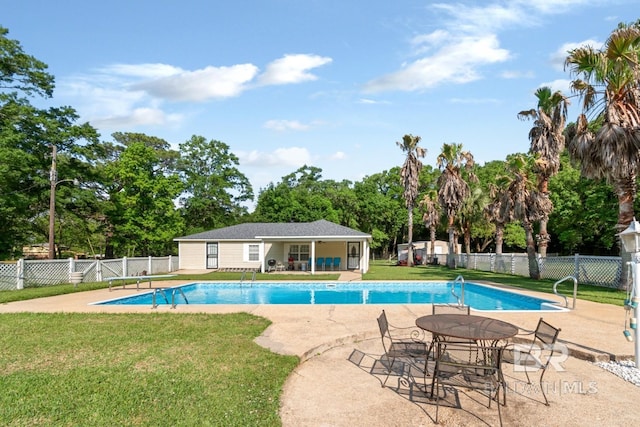 1180 Dawes Rd, Mobile, AL 36695 - view of pool with fence, an outbuilding, a yard, and a patio area