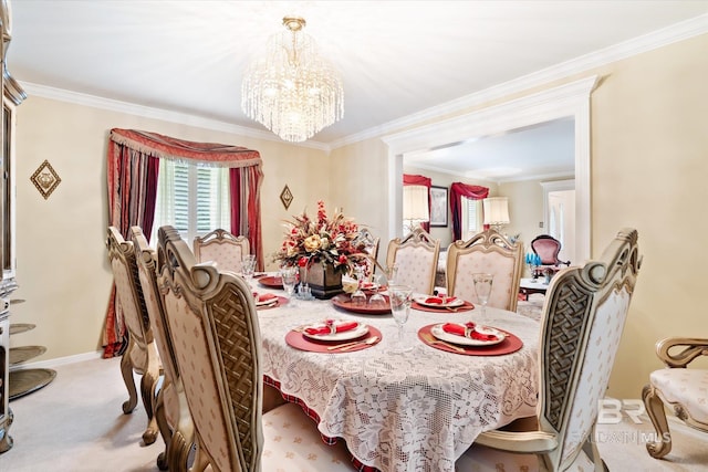 carpeted dining room with a chandelier and ornamental molding