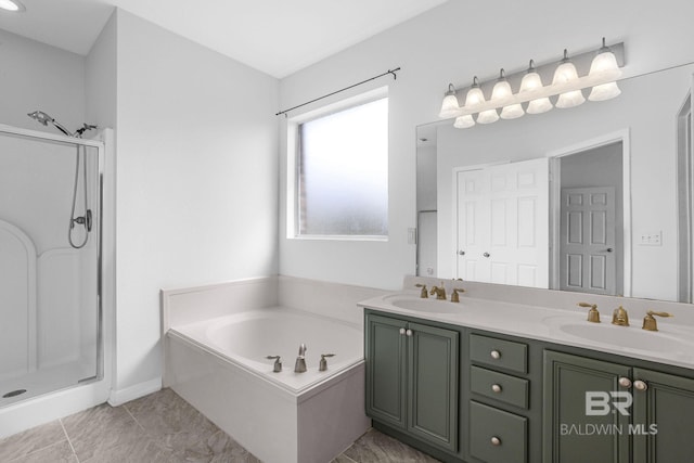 bathroom with double vanity, a stall shower, a sink, and a bath