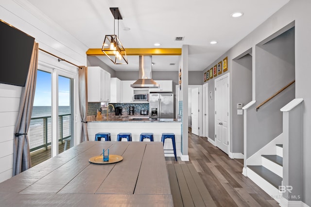 dining area featuring stairway, baseboards, visible vents, recessed lighting, and dark wood-type flooring