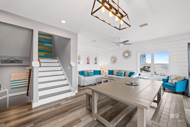 interior space with visible vents, stairs, recessed lighting, wood finished floors, and a ceiling fan