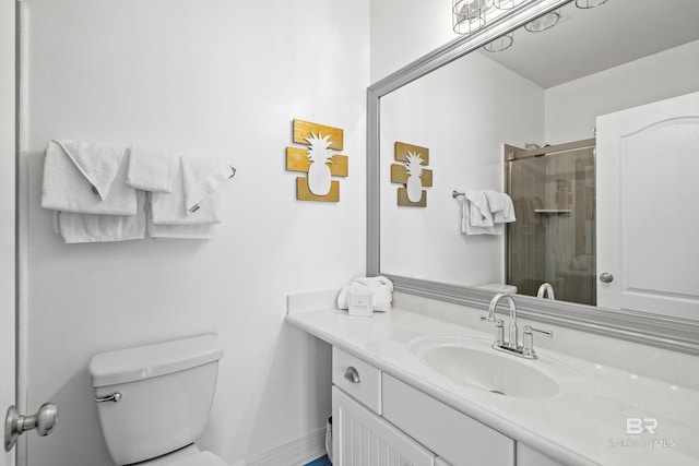 full bathroom with vanity, toilet, and a shower stall