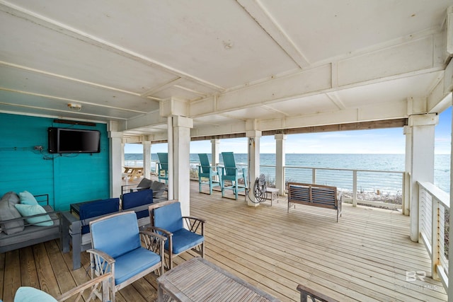 wooden deck with a water view