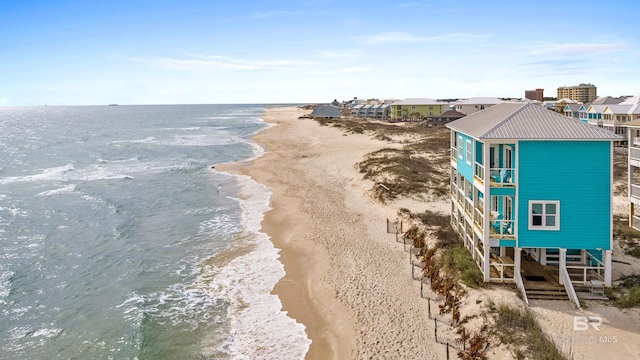 bird's eye view featuring a water view and a view of the beach