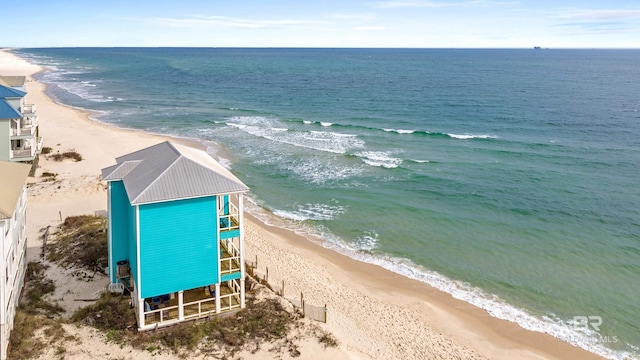 bird's eye view featuring a water view and a view of the beach