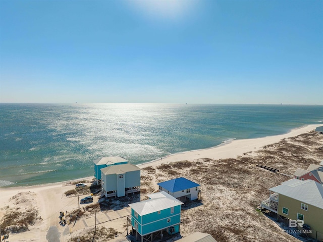 birds eye view of property featuring a water view and a view of the beach