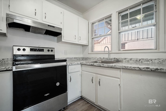 kitchen with ornamental molding, stainless steel electric stove, white cabinetry, and sink