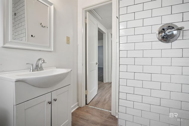 bathroom with vanity and hardwood / wood-style floors