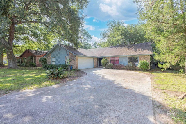 112 Windsor Ct, Daphne, AL 36526 - ranch-style house with driveway, an attached garage, a front yard, and brick siding