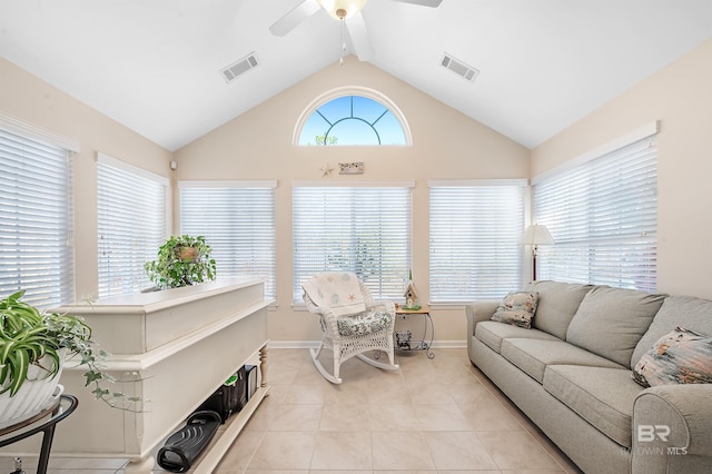 living room with ceiling fan, light tile patterned flooring, and vaulted ceiling