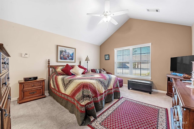 bedroom with light colored carpet, vaulted ceiling, and ceiling fan