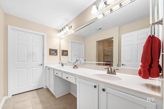 bathroom featuring tile patterned floors and vanity