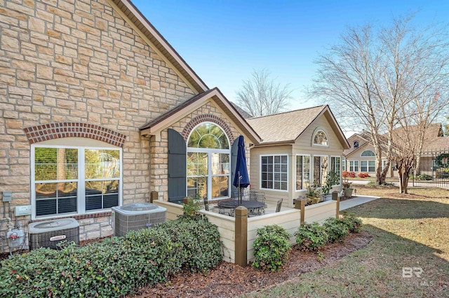 exterior space featuring central AC unit