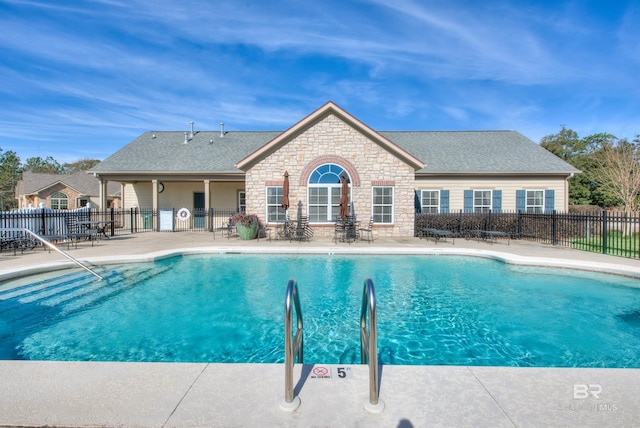 view of swimming pool featuring a patio area