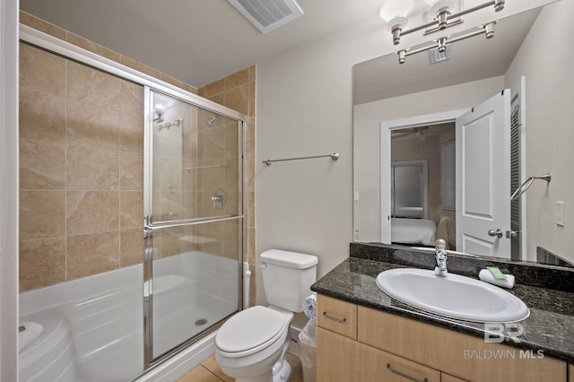 full bathroom featuring visible vents, connected bathroom, toilet, a stall shower, and vanity