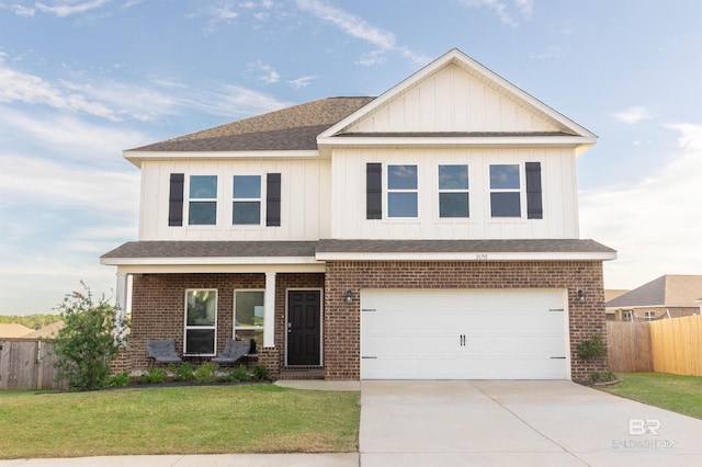 craftsman inspired home featuring a front yard and a garage