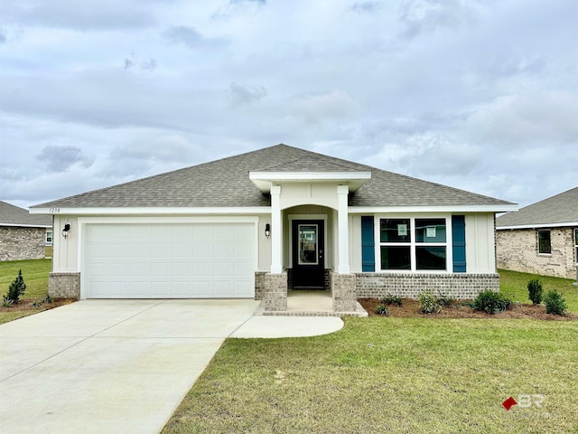 view of front of property featuring a garage, a shingled roof, concrete driveway, a front lawn, and brick siding