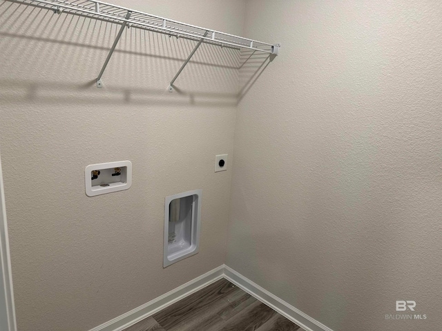 laundry area with hardwood / wood-style flooring, washer hookup, and hookup for an electric dryer