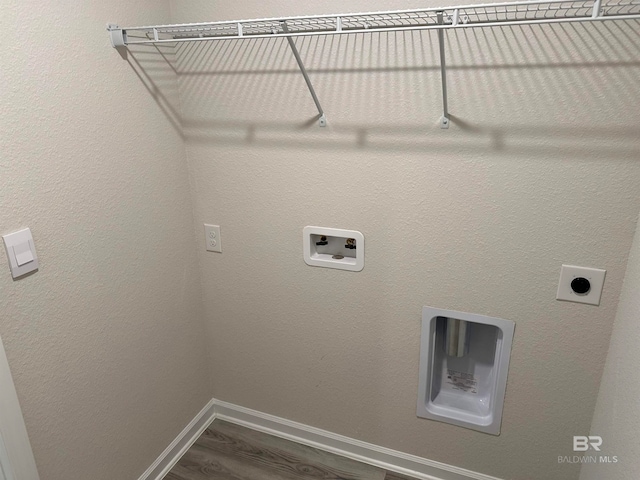 washroom with hardwood / wood-style floors, electric dryer hookup, and washer hookup