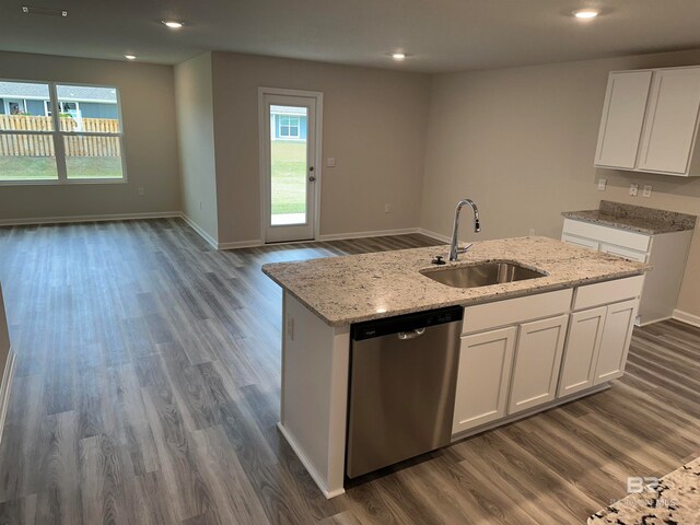 kitchen with a center island with sink, dark hardwood / wood-style flooring, white cabinetry, dishwasher, and sink