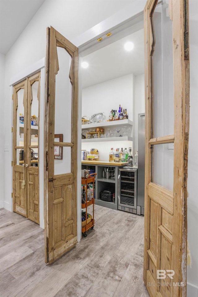 pantry featuring wine cooler