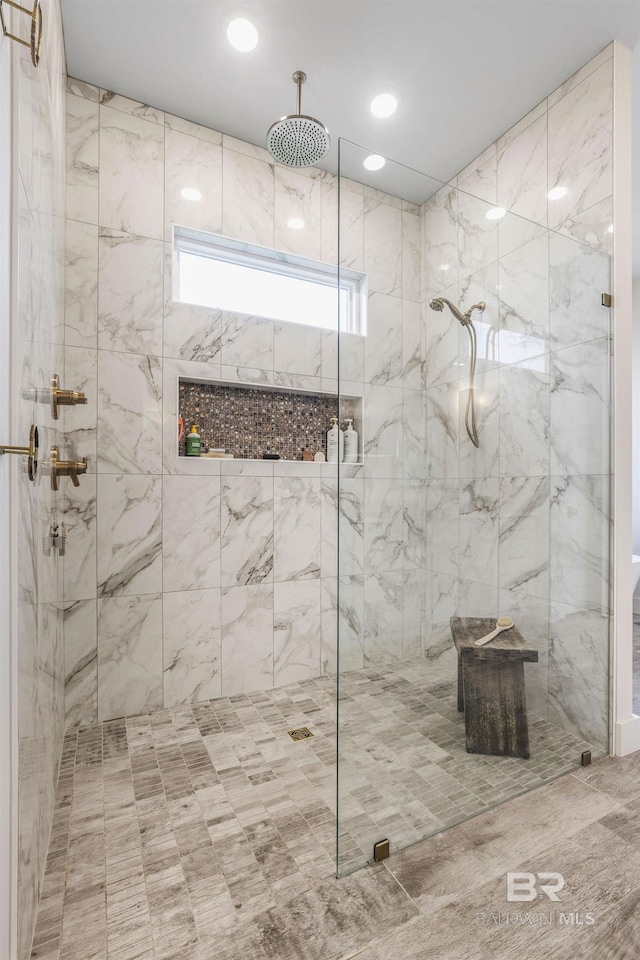 bathroom featuring a stall shower and recessed lighting