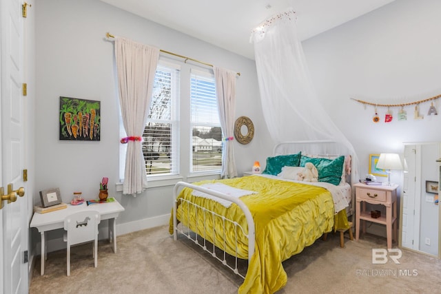 bedroom with carpet and baseboards