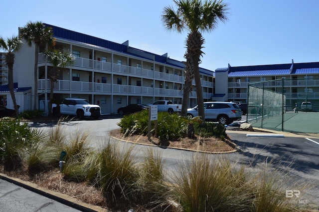 view of property featuring uncovered parking