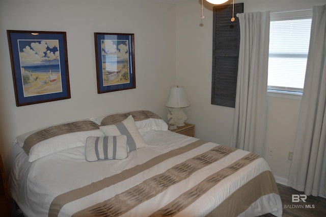 bedroom featuring wood finished floors