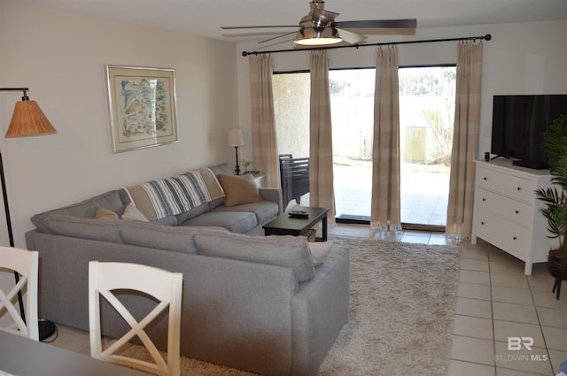 living room with light tile patterned flooring and a ceiling fan