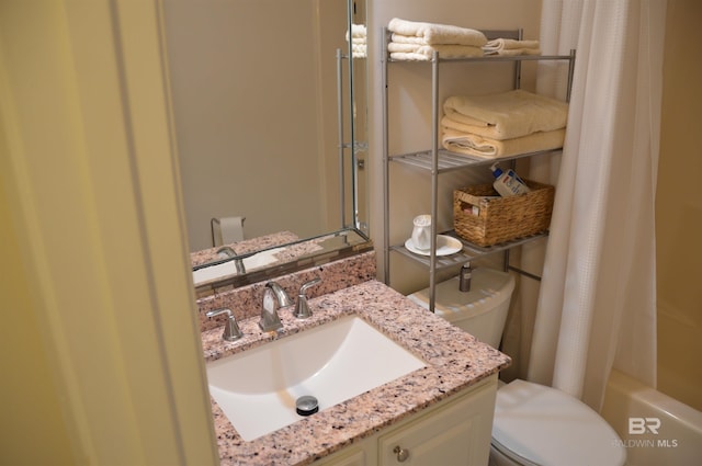 full bath featuring toilet, shower / tub combo, and vanity