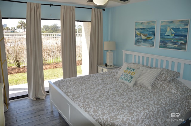 bedroom featuring wood finished floors and access to exterior