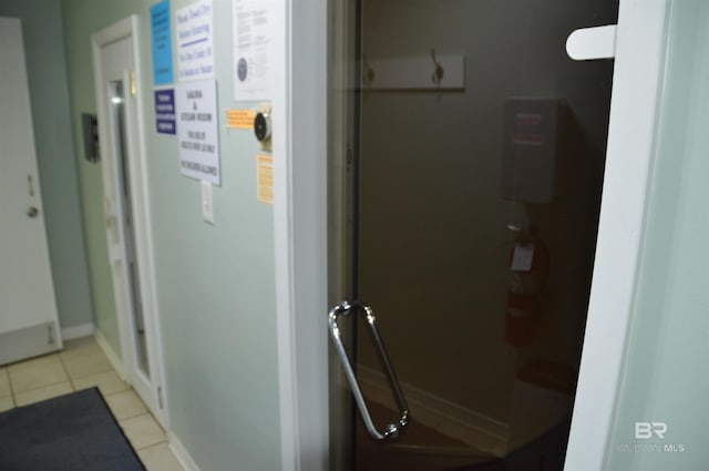 interior space featuring a fire extinguisher and baseboards