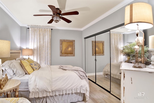 24900 Perdido Beach Blvd Unit 402, Orange Beach, AL 36561 - bedroom featuring light wood-type flooring, ornamental molding, and a closet