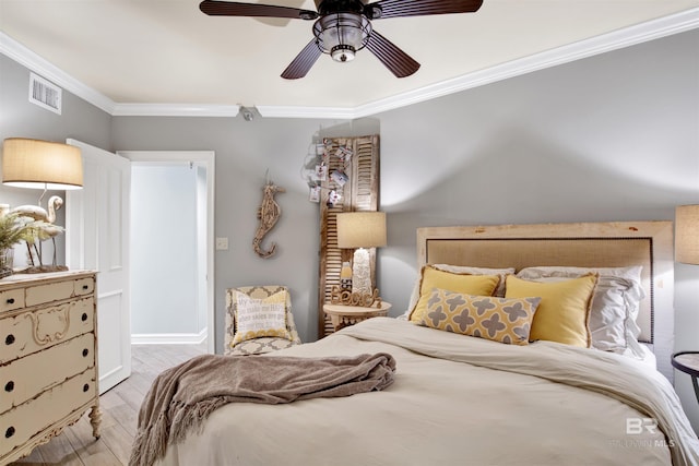 24900 Perdido Beach Blvd Unit 402, Orange Beach, AL 36561 - bedroom with visible vents, crown molding, wood finished floors, baseboards, and ceiling fan